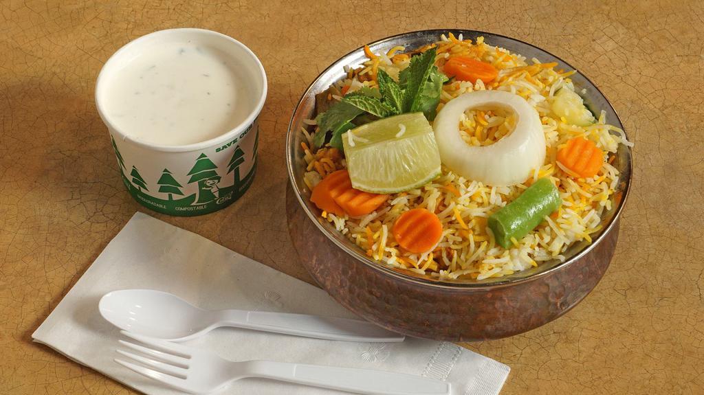 Vegetable Biryani · Mixed vegetables cooked in basmati rice with special herbs and spices.