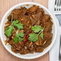 Goat Curry · Fresh goat cooked in mild curry sauce.