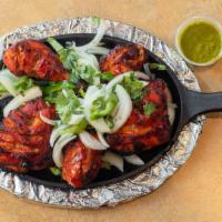 Tandoori Chicken · Chicken with bone marinated with spices and cooked in clay oven.