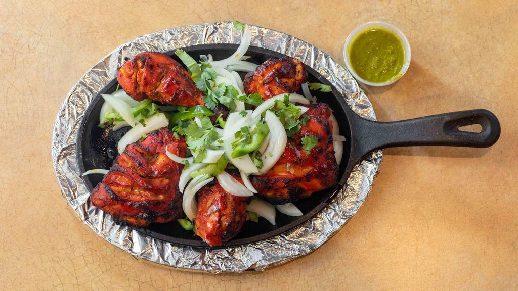 Tandoori Chicken · Chicken with bone marinated with spices and cooked in clay oven.