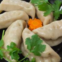 Steamed Dumplings · Served with Soy Sauce
