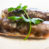 Grilled Pork Spring Rolls (2) · Served with Fish Sauce