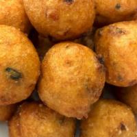 Mini Punugulu · Deep fried snack made with rice, black gram lentils and other spices served with Peanut chut...