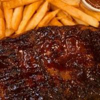 1/2 Slab Bbq Ribs With Fries & Salad · 1/2 slab of BBQ ribs with french fries and salad.
