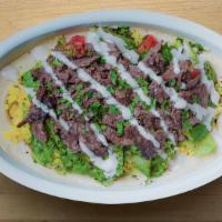Beef Shawarma Bowl · A layered Combination of Hummus, Rice, Beef Shawarma and Arabic Salad.