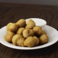 Breaded Mushrooms · Served with a side of Ranch dressing.