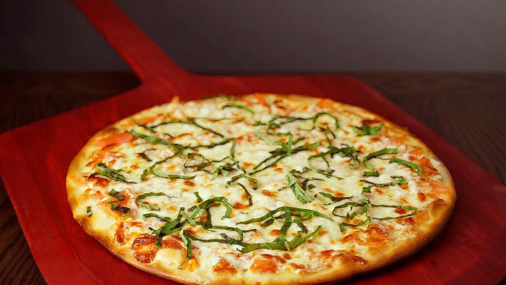 Margherita · Olive oil in place of pizza sauce with tomatoes and basil. Your choice of size is available.