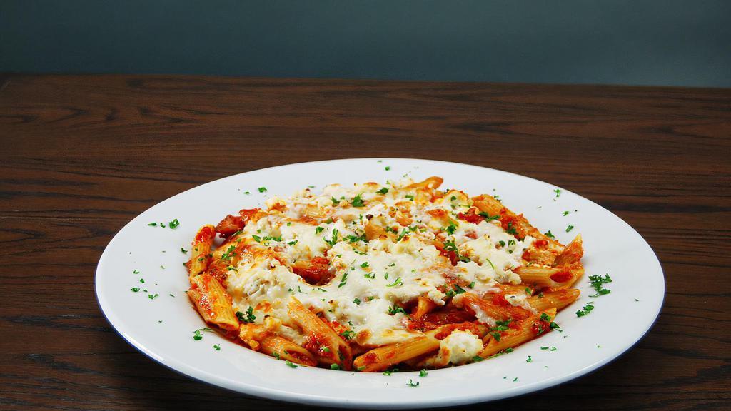 Mostaccioli Alforno · Baked penne noodles, ricotta, mozzarella and marinara sauce. Served with garlic bread and grated cheese.
