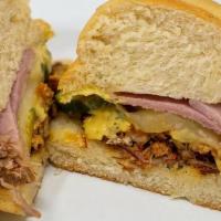 Cuban · House-Smoked Pulled Pork + Smoked Ham + Dill Pickle + Provolone Cheese + Dijon Mustard