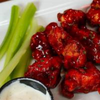 Wings · 12 wings tossed in your choice of sauce buffalo, honey bbq , bbq, honey sriracha, 
one side ...