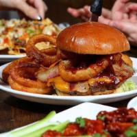 Kansas City · 1/2 pound Angus burger with melted cheddar, 2 golden onion ring , bacon and bbq sauce