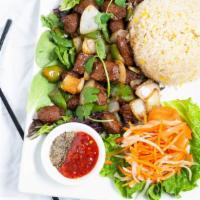 Shaky Beef · Bò lúc lắc. Butcher's cut beef, stir-fried with bell peppers and onions, served with chef's ...