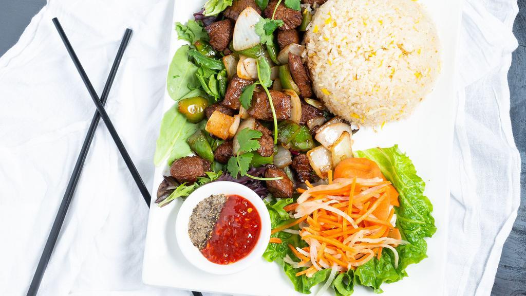 Shaky Beef · Bò lúc lắc. Butcher's cut beef, stir-fried with bell peppers and onions, served with chef's special rice.