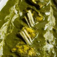 Palak Paneer · Mildly spiced cottage cheese preparation in spinach and onion gravy, garnished with coriande...