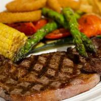 Filete New York · Con papas fritas or vegetables asados grilled steak served with your choice of French fries ...