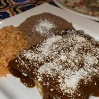 Enchiladas De Mole · Three enchiladas filled with cheese, chicken tinga or beef topped with mole and cotija chees...