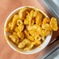 Mac N' Cheese · Spiral noodles tossed in a four cheese sauce blend.