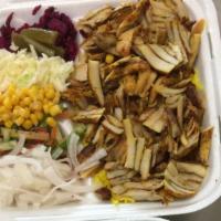 Chicken Shawarma Entree · Thin slices of chicken served with rice and salad.