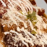 Enchiladas · Chicken or cheese enchiladas topped with mole, red or green salsa, covered with cheese & sou...