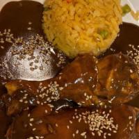 Mole Poblano · Chicken topped with traditional mole poblano made from the ground & roasted chocolate, spice...