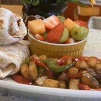 Breakfast Burritos · Two medium-sized burritos served with fresh fruit & house potatoes. Meat choice: Chorizo, Ha...