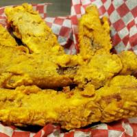 Fried Ribs · Our famous ribs lightly battered and fried golden brown, topped with your choice of sauce.