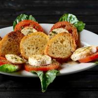 Caprese · Sliced fresh mozzarella cheese, Roma tomatoes, basil leaves and croutons, dressed with a red...