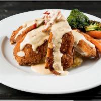 Almond Chicken · Chicken breast, breaded with thin almond slices, fried and served over warm basmati rice and...