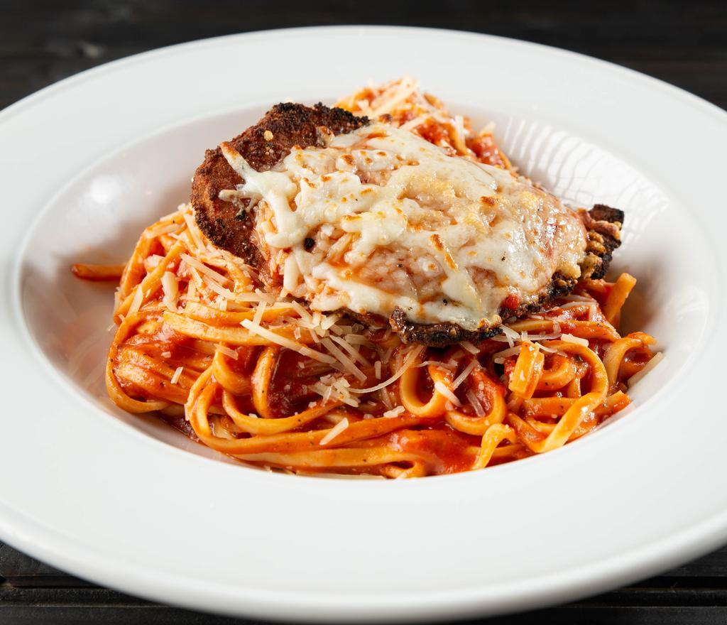 Chicken Parmesan · Breaded chicken breast topped with marinara sauce, Parmesan cheese and mozzarella cheese. Served with linguine pasta tossed in our housemade marinara sauce. Add chicken breast for an additional charge.