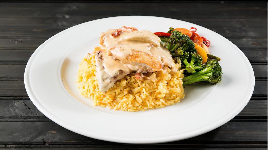 Chicken Piccata · Sautéed chicken breast, artichokes sun-dried tomatoes, served over warm basmati rice and sautéed vegetables, topped with our house-made lemon cream sauce. Add chicken breast for an additional charge.
