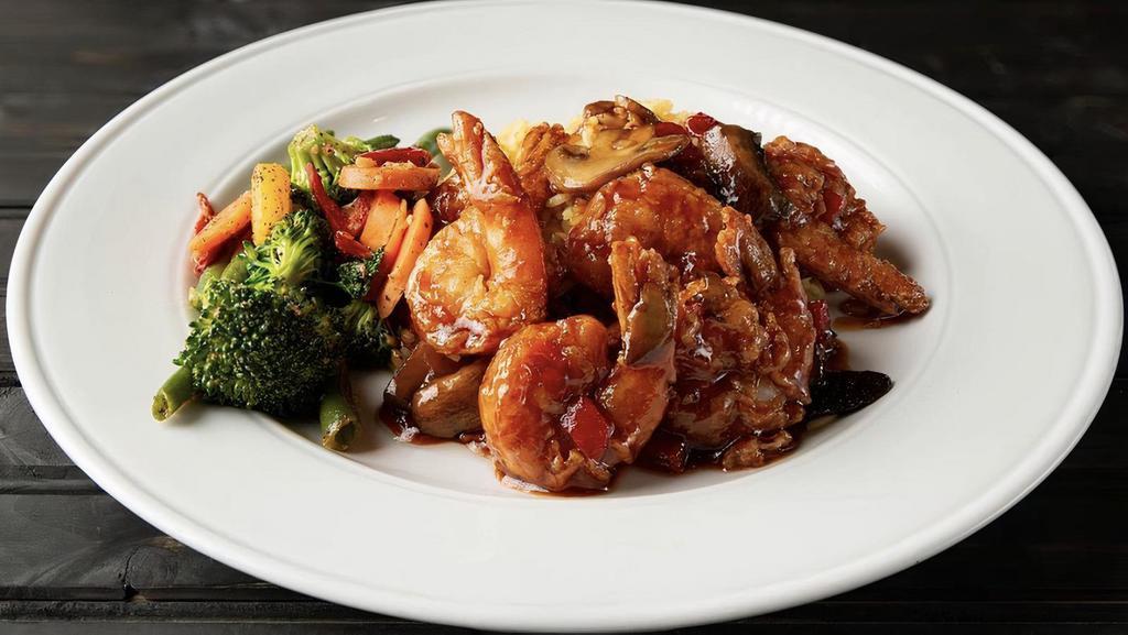Firecracker Shrimp · Large gulf shrimp lightly floured and fried tossed with sautéed roasted red peppers and mushrooms in our sweet and spicy firecracker sauce, served with mashed potatoes and sautéed vegetables.