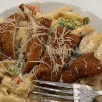 David Allen Pasta · Penne noodles tossed in our housemade Alfredo sauce and mixed vegetables. Topped with Parmes...