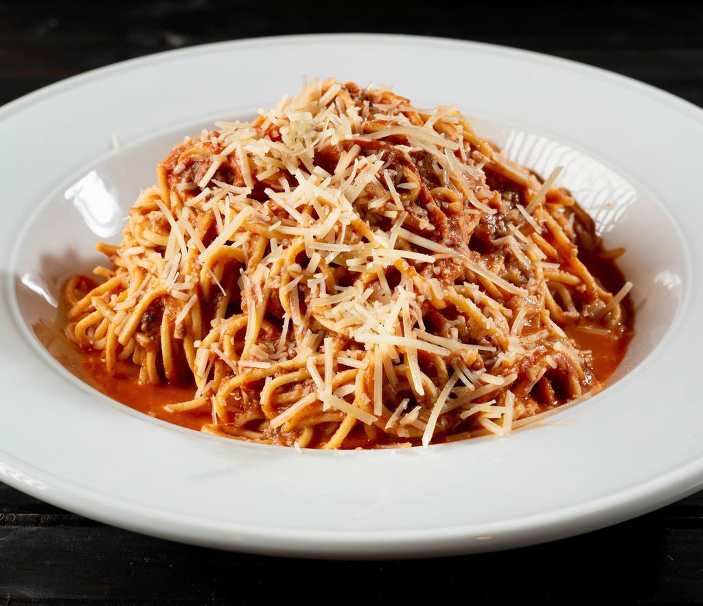 Spaghetti Bolognese · Spaghetti noodles tossed in our house-made Bolognese meat sauce, topped with Shredded Parmesan cheese.