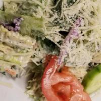 Side House Salad · Artisan greens, Romaine, and iceberg tossed in our signature creamy Parmesan vinaigrette dre...