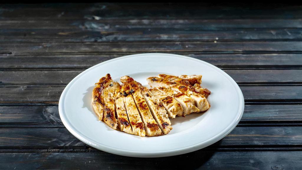 Grilled Chicken Breast · A whole marinated and grilled chicken breast, a perfect addition to any salad.