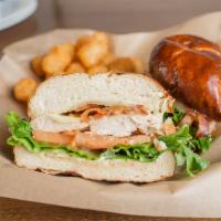 Grilled Chicken Sandwich · Served on a soft pretzel roll w/ lettuce, tomato, bacon, avocado, Provolone cheese and Dijon...
