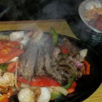 Sizzling Fajita Lunch · Award-winning. Your choice of chicken, steak, veggie or a combination served with sour cream...