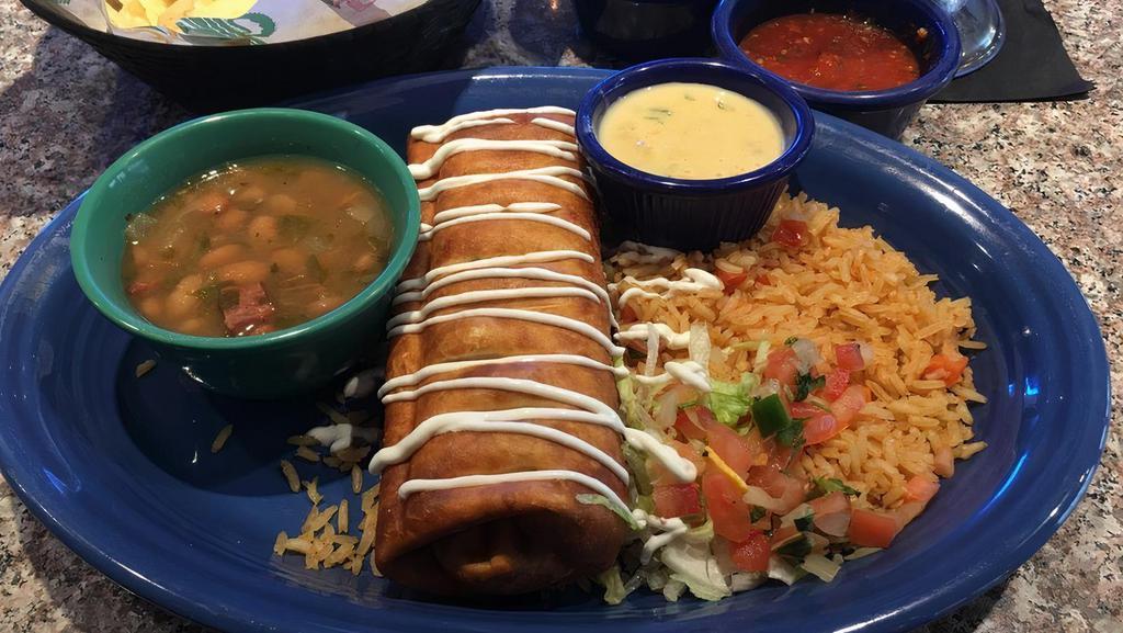 Lunch Chimichanga · Your choice of seasoned ground beef or fajita chicken rolled into a crispy flour tortilla and topped with sour cream and your favorite sauce.