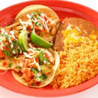 Mexico City Tacos · Three corn tortillas with your choice of chicken, steak or carnitas topped with cheese, onio...