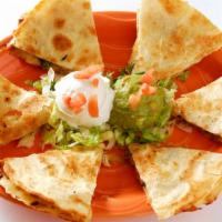 Shrimp Quesadillas · Pepper jack cheese, fresh-grilled shrimp, sautéed tomatoes, poblano peppers and onions in a ...