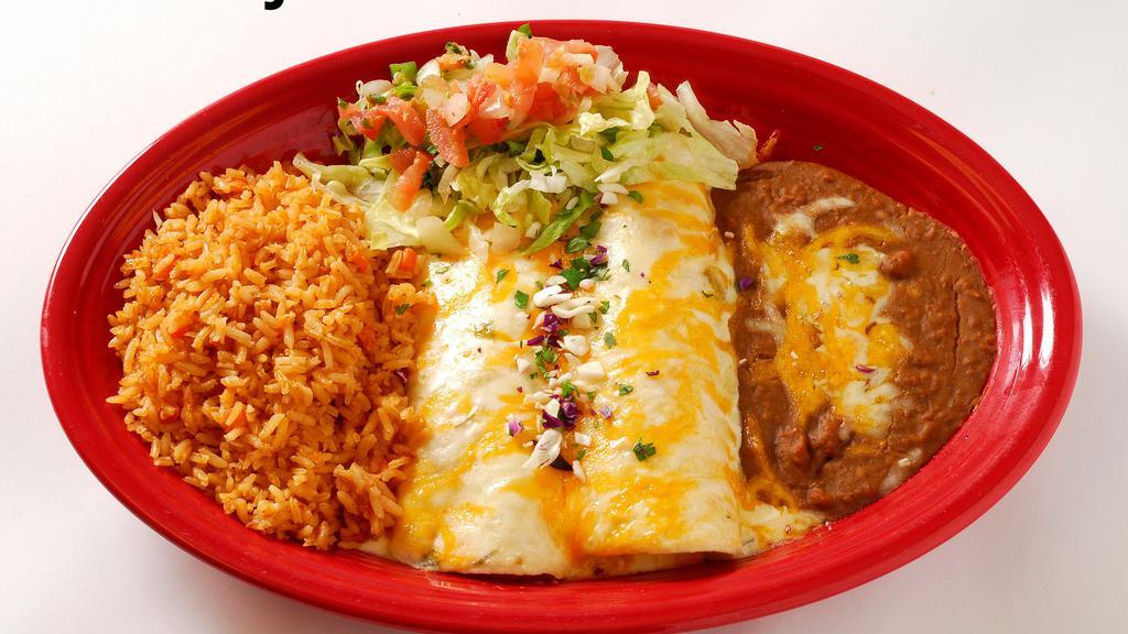 Fajita Chicken Enchiladas · Tender, diced marinated chicken breast rolled into two flour tortillas and topped with homemade sour cream sauce.