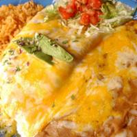 Seafood Enchiladas · Shrimp, scallops and fresh avocado rolled into corn tortillas topped with homemade sour crea...