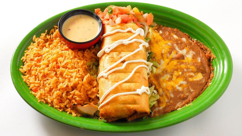 Chimichanga · Your choice of seasoned ground beef or fajita chicken with shredded cheese folded into a flour tortilla and lightly fried then drizzled with sour cream. Served with your choice of sauce on the side.
