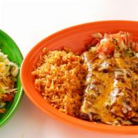 Juarez · One beef enchilada, one cheese enchilada, a handmade spicy beef tamale, and a beef tostada.