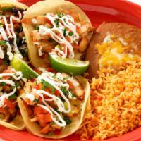 Mexico City Tacos · Four soft corn tortillas served open-faced with your choice of chicken, steak or carnitas  t...