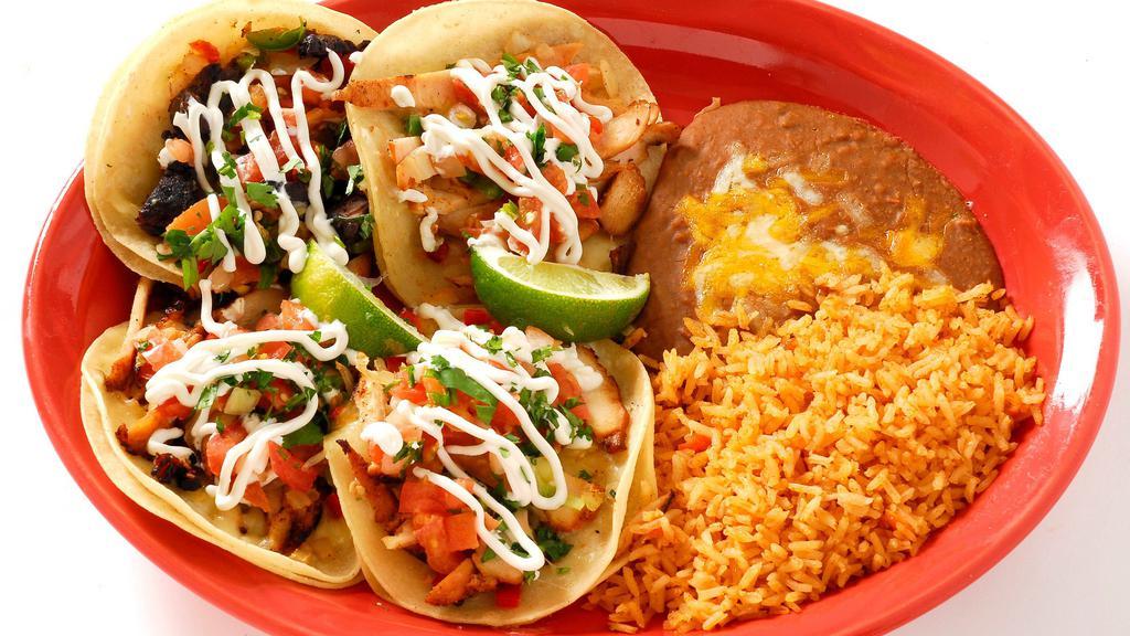 Mexico City Tacos · Four soft corn tortillas served open-faced with your choice of chicken, steak or carnitas  topped with pepper jack cheese, cilantro, grilled peppers and onions, pico de gallo and sour cream.