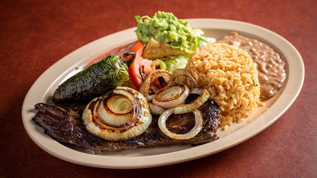 Carne Asada · U.S. choice steak / outer skirt served with delicious guacamole and grilled onion.