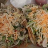 Chicken · Two chicken tacos dressed with pico de gallo shredded lettuce and shredded cheese
