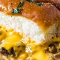 Philly Cheesesteak Sliders · Thin sliced roast beef, onions and mushrooms topped with American cheese. Served with steak ...