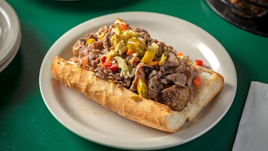 Italian Beef & Sausage Combo · Served on freshly baked Italian bread with your choice of hot or sweet peppers and marinara sauce. Served on garlic bread for an additional charge. Add mozzarella for an additional charge.